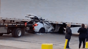 An image of a Tesla Model Y that crashed into a semi truck.