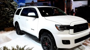 A white Toyota Sequoia on display at an auto show