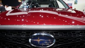 A red Subaru Forester on display at an auto show