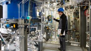 A work checks equipment in Sunfire's Dresden, Germany synthetic fuel pilot plant