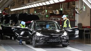 Employees work at the Tesla Gigafactory in Shanghai, east China, Nov. 20, 2020. U.S. electric car company Tesla in 2019 built its first Gigafactory outside the United States