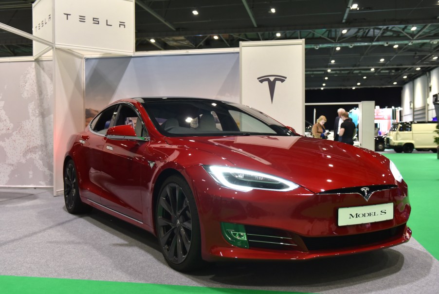 A red Tesla Model S four-door electric car on display during the London Motor & Tech Show at ExCel on May 16, 2019, in London, England