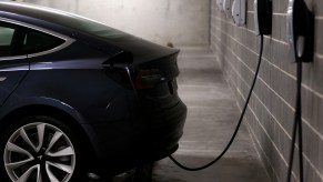 A Tesla Model Y plugged in and charging at home