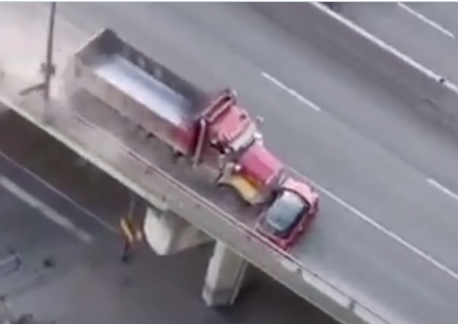 Toronto dump truck dragging a Mini sideways