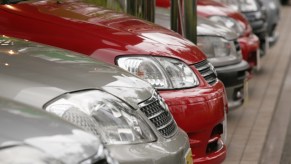 Rows of Toyota Corolla vehicles await buyers at the Toyota Corolla showroom in Tokyo, Japan, on Monday, March 5, 2007