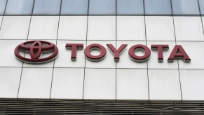 A Toyota sign on the building of a showroom