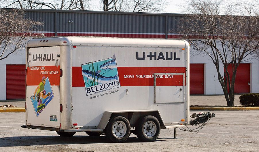 U-Haul trailer looking abandoned in a parking lot