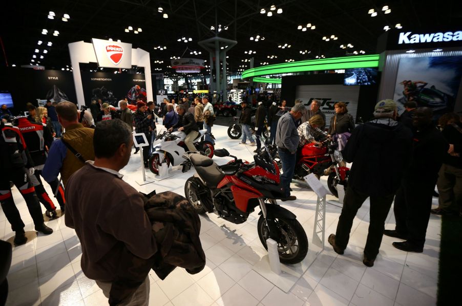 Visitors look at motorcycles from various brands at the Progressive International Motorcycle Show