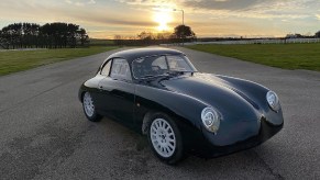 A black WEVC Coupe development prototype on a track