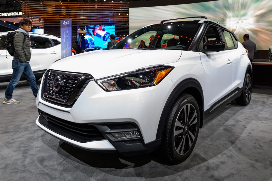 A white Nissan Kicks on display at an auto show