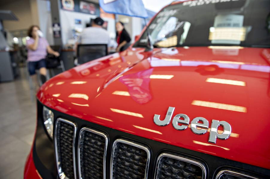 A red Jeep Renegade SUV sits on display