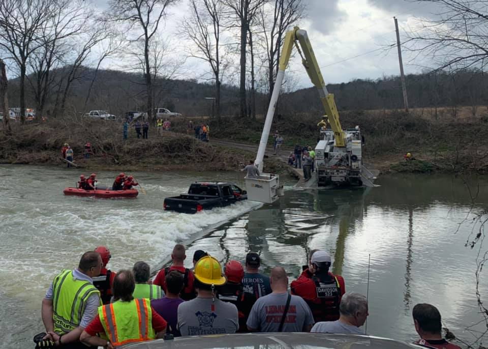 First responders rescuing family from Ram 1500 Classic in floodwater