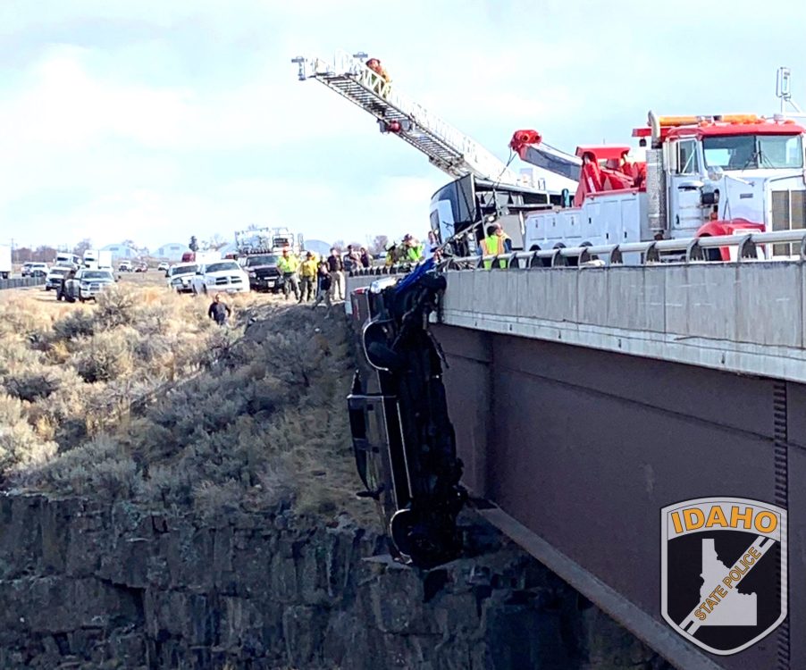 Ford F-350 dangling over bridge