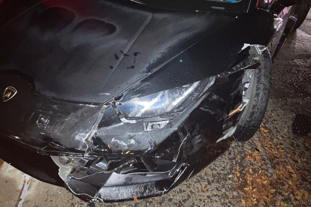 An image of a crashed Lamborghini Huracán Spyder outside of McDonald's.