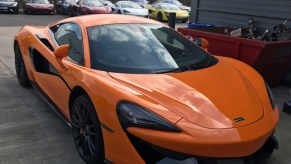 Stolen McLaren in orange sitting in a parking lot