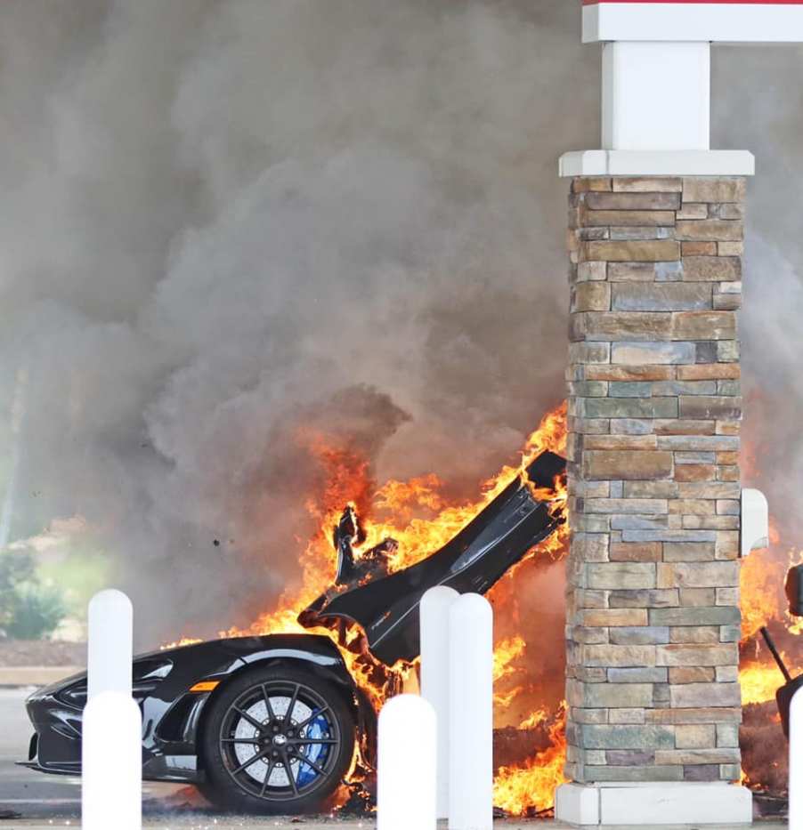 An image of a McLaren 765 LT on fire at a gas station.