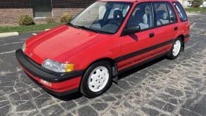 A red 1991 Honda Civic 4WD Wagon in a parking lot