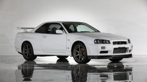 A white 2002 R34 Nissan Skyline GT-R V-Spec II Nur in a studio