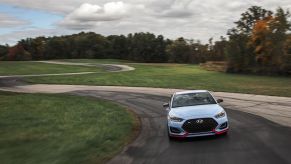 Performance Blue 2019 Hyundai Veloster N being tested on Car and Driver track