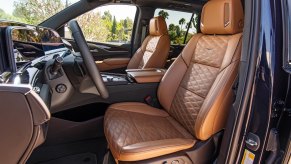 A 2021 Cadillac Escalade Brandy interior with Very Dark Atmosphere accents and full leather seats with faceted quilting