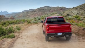 2021 Chevrolet Silverado LT Trail Boss driving down a dirt road