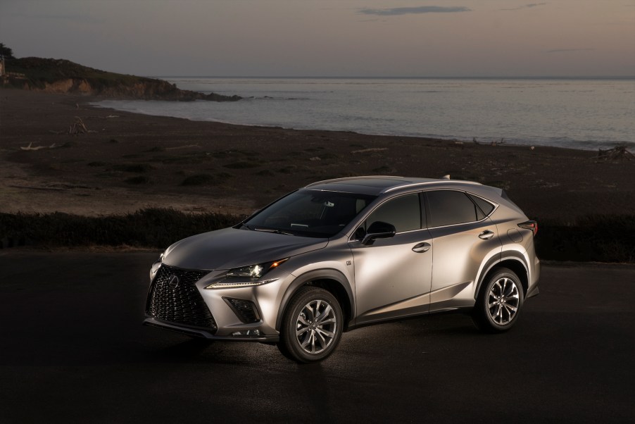 A silver 2021 Lexus NX300 luxury compact crossover SUV parked on a beach