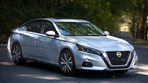 A silver 2021 Nissan Altima parked in the shade