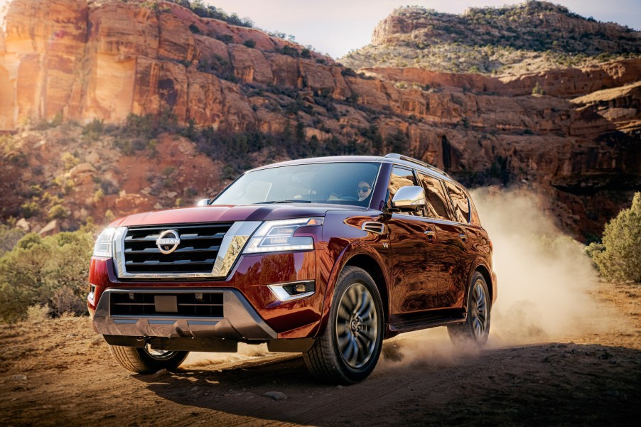 2021 Nissan Armada driving up a dirt hill