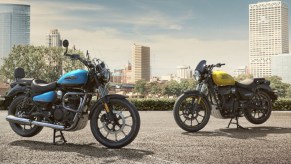 A light-blue 2021 Royal Enfield Meteor 350 Stellar next to a yellow 2021 Royal Enfield Meteor 350 Fireball