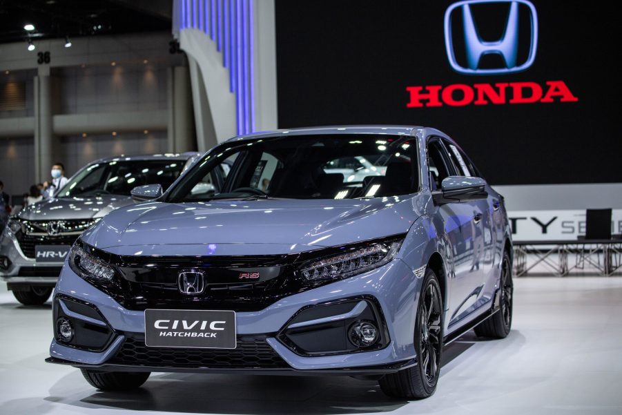 a lavender 2021 Honda Civic (similar to the hybrid Insight) on display