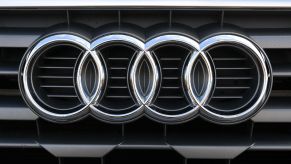 The silver logo of the German automaker Audi is seen on a car's grille on March 18, 2021, at its headquarters in Ingolstadt, Germany