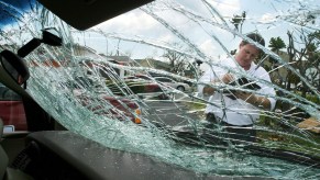 Insurance adjuster through broken windshield