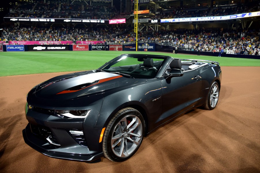 A Chevy Camaro SS sits on a baseball field