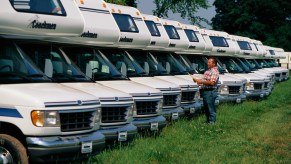 A worker logs in Coachmen RVs outside the company's factory in Goshen, Indiana, in 1996