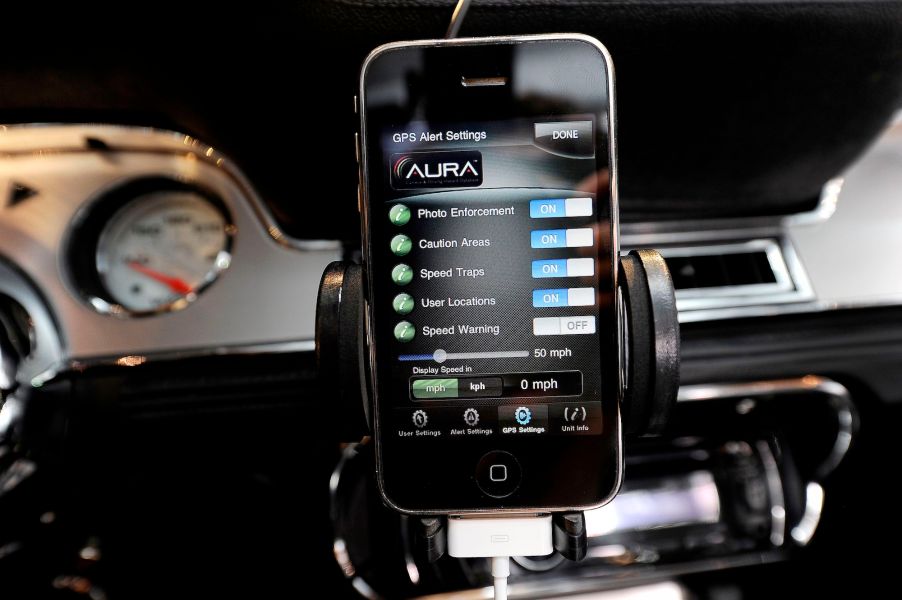 A Cobra radar detector app on an iPhone mounted in a 1967 Shelby Cobra GT500 CR