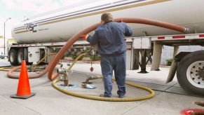 A tanker truck delivers gasoline to a gas station | Tim Boyle/Getty Images