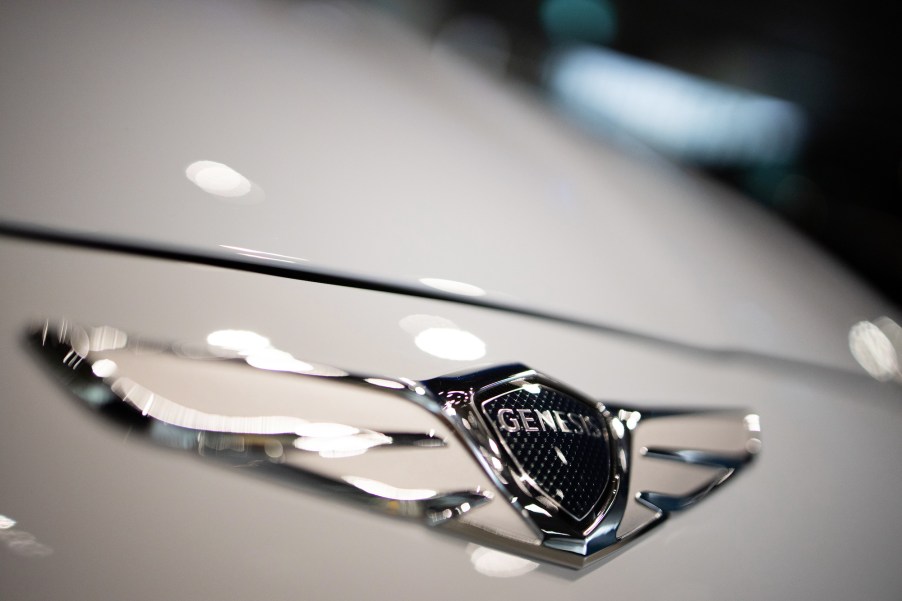 The Hyundai Motor Co. Genesis badge is displayed on the hood of a white vehicle at the company's Motorstudio showroom in Goyang, South Korea, on Friday, July 19, 2019