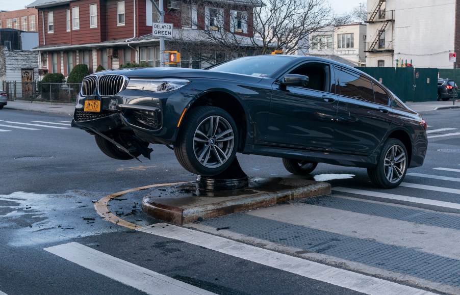 An image of a crashed car out on the road.