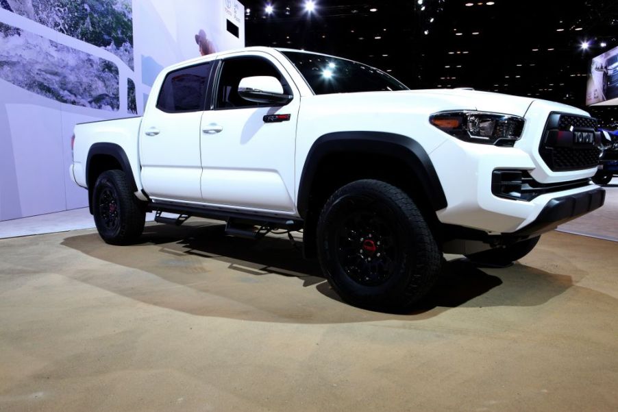 a white 2017 Toyota Tacoma trd pro on display at an auto show