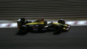 An image of a Lamborghini-powered Formula 1 car out on a track.