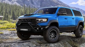 A blue Hennessey Mammoth 1000 SUV in the mountains