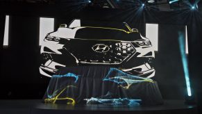 A Hyundai Motor Co. Santa Cruz Concept vehicle sits under a sheet prior to its unveiling during the 2015 North American International Auto Show