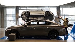 A customer inspects the trunk of a gray Hyundai Motor Co. Sonata N Line sedan at the company's Motorstudio showroom in Seoul, South Korea