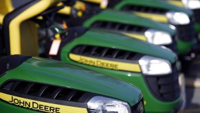 Deere Co. John Deere brand riding lawnmowers are displayed for sale outside a Lowe's Cos. store in Louisville, Kentucky, U.S.