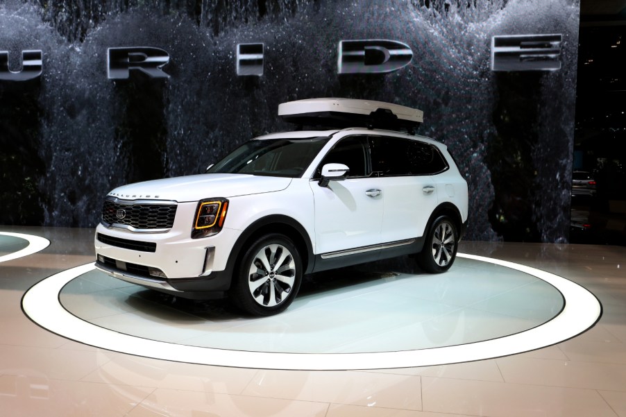 A white Kia Telluride sits on display at an auto show