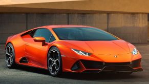 An image of an orange Lamborghini Huracan Evo parked outdoors.