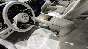 The white steering wheel of a Mercedes-Benz AG EQS electric sedan at the Auto Shanghai 2021 show