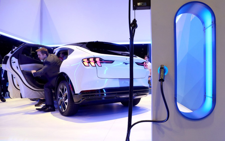 A Ford Mustang Mach-E charging on display