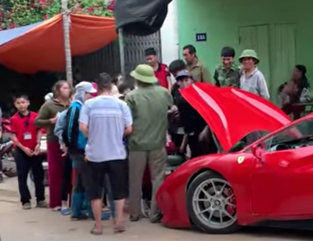 Phony Ferrari Melon Vendor with crowd