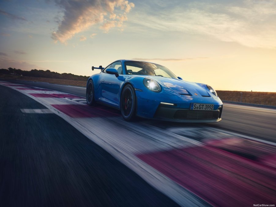 An image of a blue 2022 Porsche 911 GT3 on a track.